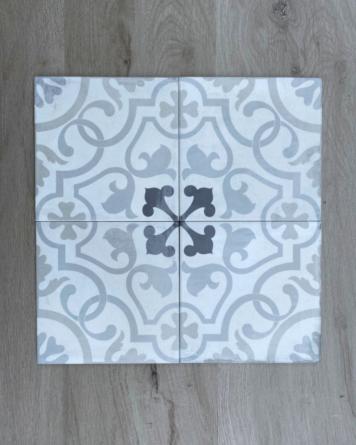 Cement tile "used look" with floral pattern linked